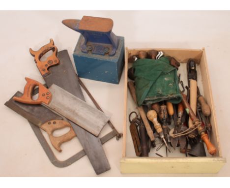 A box of vintage tools, a Record anvil and five handsaws.