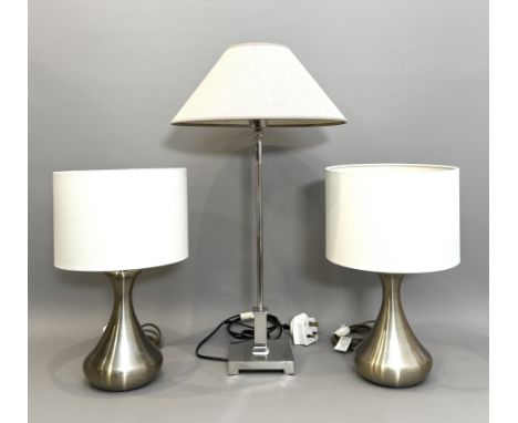 Three modern table lamps - comprising a pair of brushed antique brass finish lamps, with touch-operation and cream fabric dru