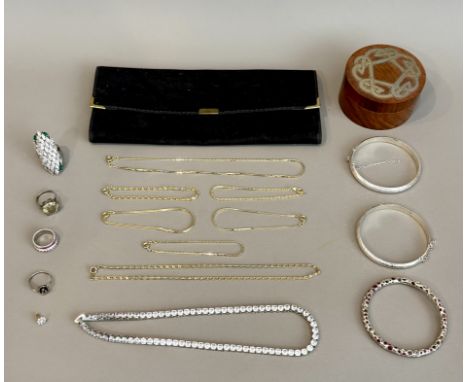 A small group of silver and costume jewellery - including two bright cut hinged sterling silver bangles; a brushed and polish