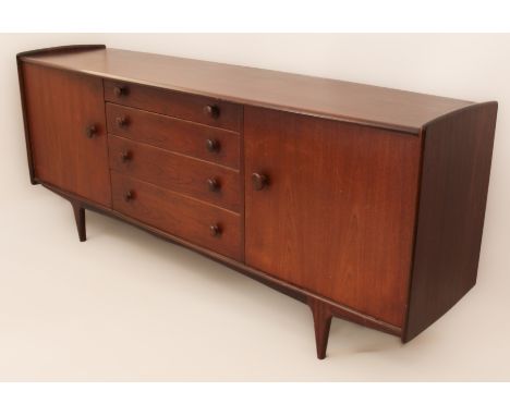A vintage 1970s afrormosia 'Volnay' sideboard by A. Younger Ltd. - the slightly bowfront top over a central bank of four grad