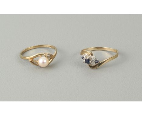 Two vintage 9ct yellow gold rings - comprising a sapphire and diamond 7 stone twist ring, London import hallmarks 1988, size 