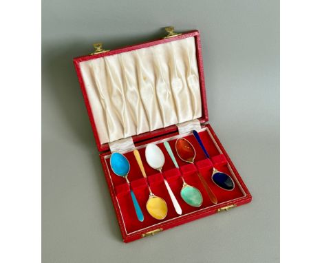 A cased set of six Elizabeth II silver gilt and enamel coffee spoons - S. J. Rose &amp; Son, Birmingham 1972, each in a diffe