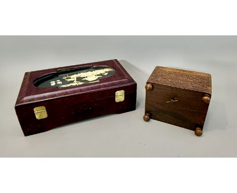 Two decorative boxes - comprising a late 20th century Oriental lacquer jewellery box with miniature 3D cork diorama under gla