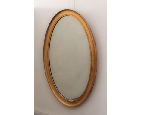 An unusually large oval giltwood mirror, late 19th / early 20th century - with cavetto frame, 118 x 78cm.