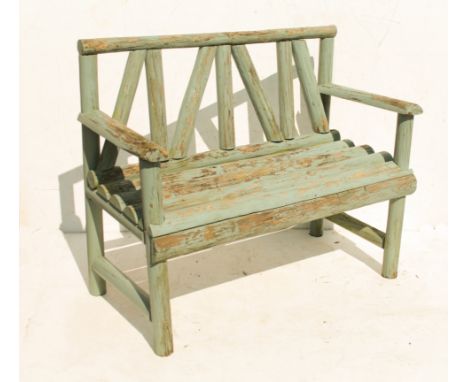 A painted rustic wooden garden bench (LWH 112 x 52 x 90 cm).