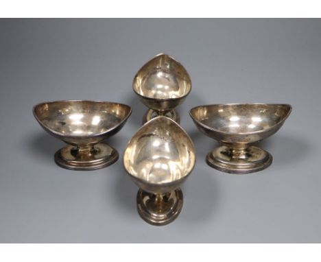 A set of four George III silver navette shaped pedestal salts, Thomas Wallis II, London, 1801, height 58mm, gross 9 oz, with 
