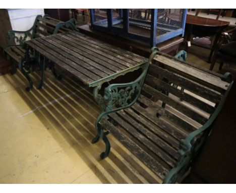 Four cast metal slatted wood garden armchairs and matching rectangular table, table width 126cm