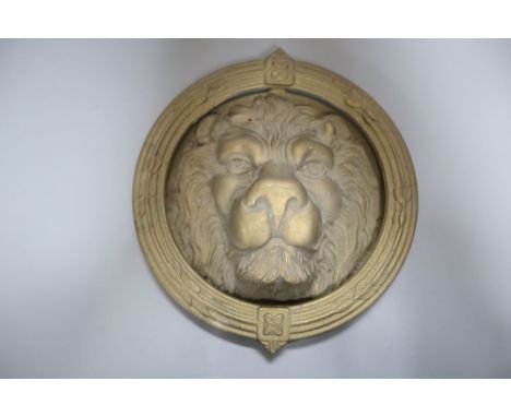 A large cast brass lion's head door knocker, diameter 21cm