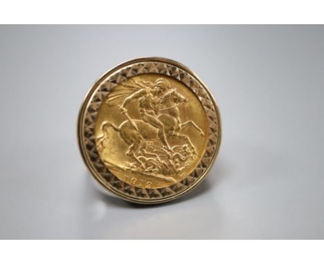 A George V 1912 gold sovereign, now in 9ct gold ring mount, size Q, gross 14.1 grams.