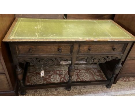 An oak side table fitted leather skiver over two short drawers, width 108cm, depth 52cm, height 68cm