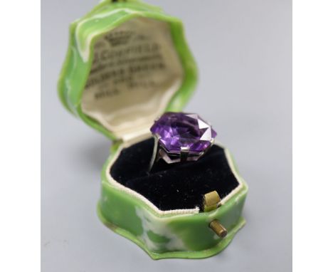 A white metal (stamped 18ct) and fancy hexagonal cut solitaire amethyst dress ring, size K, gross 6.3 grams.CONDITION: There 