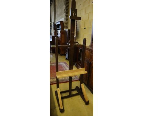 An early 19th century oak studio artist's easel, width 55cm (incorporates later timber)