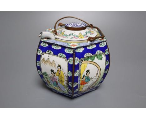 A polychrome-enamelled ceramic wine pot and cover with hexagonal outer case decorated figures in reserves