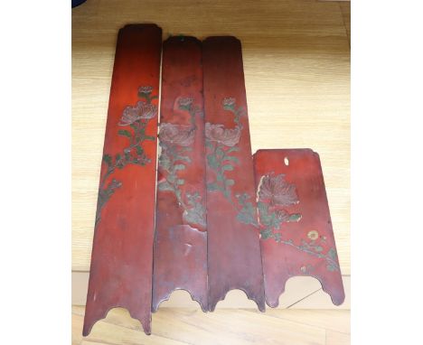 Four Japanese red lacquered hardwood panels, decorated with chrysanthemums, largest panel height 79cm
