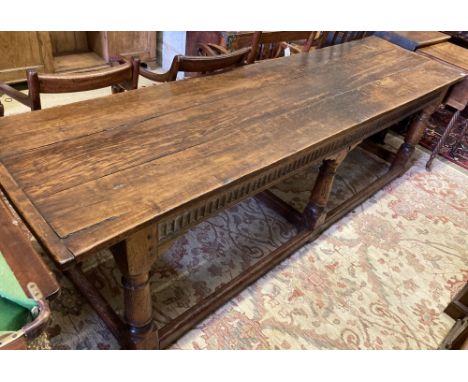 A 17th century style oak refectory table, width 262cm, depth 71cm, height 75cm