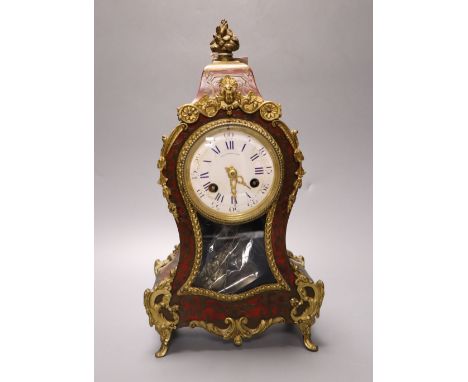 A 19th century French boullework and ormolu mounted mantel clock, dial signed by retailer Thos. Pearce and Sons, Paris, 31cm