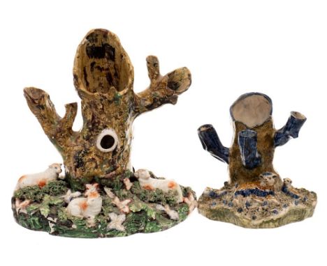 A large early 19th century Staffordshire sheep and tree trunk spill group and one similar: the first of Walton type, the moun