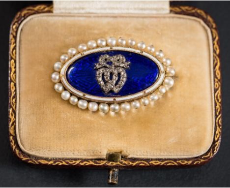 An early 20th Century enamelled gold, diamond and seed-pearl oval brooch: with central rose diamond double heart motif on a b