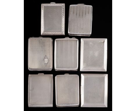 A collection of eight assorted silver match book cases, various makers and dates: with engine turned decoration, total weight