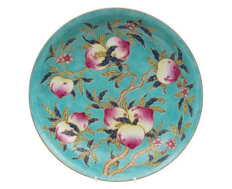 A Chinese famille rose peach dish: enamelled with branches of peaches, leaves and blossom on a turquoise ground, the reverse 