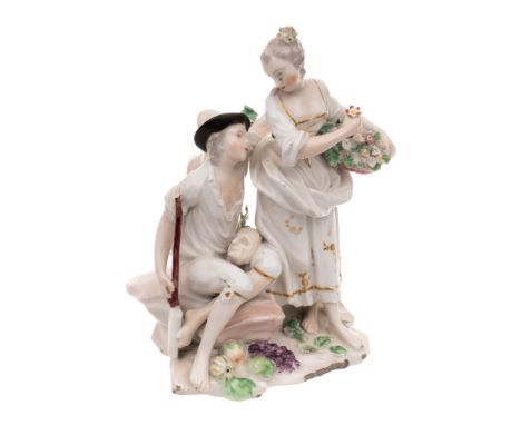 A Derby figural group of 'Gardeners': the seated man with a mask resting on his knee, a spade to his side, his companion hold