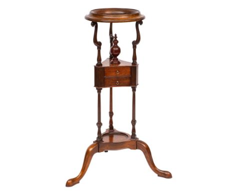 A mahogany and oak circular basin stand in the Georgian taste:, the aperture on shaped supports, central triangular platform 