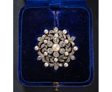 A late 19th Century gold, silver, diamond and button pearl circular brooch/pendant: with central button pearl approximately 7