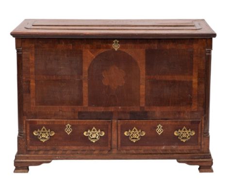 An 18th Century oak and walnut crossbanded Dower chest: the rectangular hinged top with a crossbanded border, the front with 