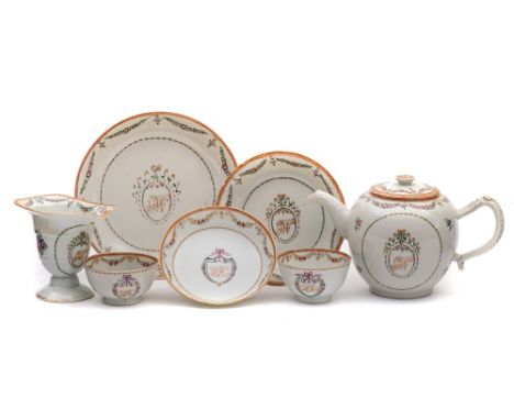 A Chinese Export famille rose part tea service: painted with the initials 'GW' contained within a ribbon tied cartouche, the 