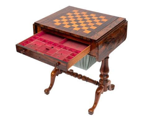 A Victorian rosewood games and work table:, the hinged top with rounded corners, having a central slide inlaid for chess on o