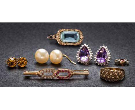 A 9ct gold, ruby and diamond bar brooch, a pair of amethyst and diamond pear-shaped ear studs, a diamond and gem-set three-st