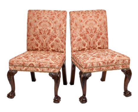 A pair of mid 18th Century and later carved mahogany side chairs in the Chippendale taste:, with rectangular upholstered stuf