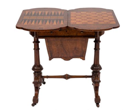 A Victorian burr walnut and inlaid games and work table:, bordered with boxwood lines and decorated with floral foliate desig