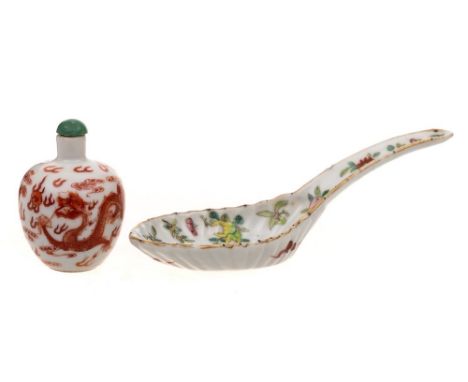 A Chinese famille rose spoon and a Chinese porcelain snuff bottle: the first painted with fruits and floral sprays, the rever