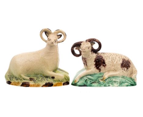 A creamware figure of a reclining ram of Yorkshire type and one similar: the first on mound base decorated in Pratt colours, 