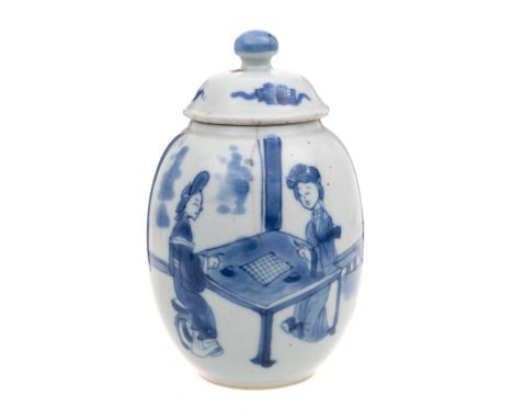 A Chinese blue and white tea caddy and cover: of ovoid form with domed cover, painted with two ladies on a terrace playing a 