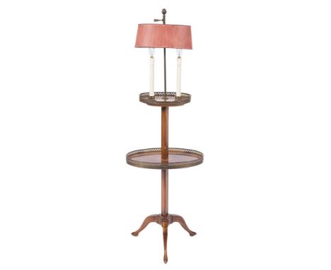 A stained beech and brass galleried oval etagere lamp:, with twin candle lamps and adjustable crimson shade, the two graduate