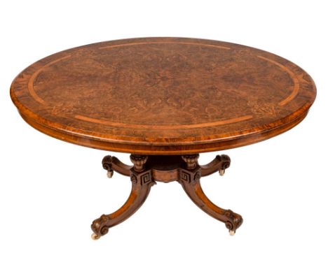 A Victorian walnut, banded and inlaid oval breakfast table:, the burr figured quarter veneered snap top with a lighter burr w