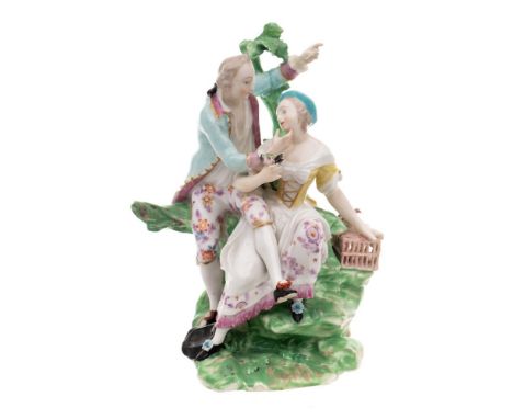A Derby figural group emblematic of 'Liberty': modelled as a gallant and lady, she with one hand resting on an open birdcage,