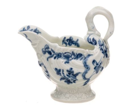 A First Period Worcester dolphin ewer creamboat: of rococo shell moulded form with lamprey handle, painted with a large butte