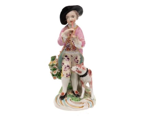 A Derby figure of a boy musician: wearing a puce jacket and floral breeches, his dog seated to one side, on scrollwork mound 