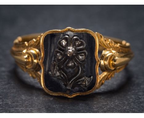 A mid 19th Century black enamelled gold and diamond mourning ring: with rose diamond-set 'forget-me-not' motif on a rectangul