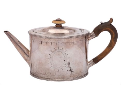 A George III  silver teapot, maker Thomas Daniell, London, 1786: of oval outline with shallow domed hinged lid, having chased