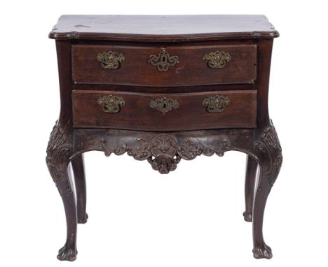 A 19th Century Portuguese carved hardwood serpentine fronted commode:, the top with a moulded edge and projecting rounded cor