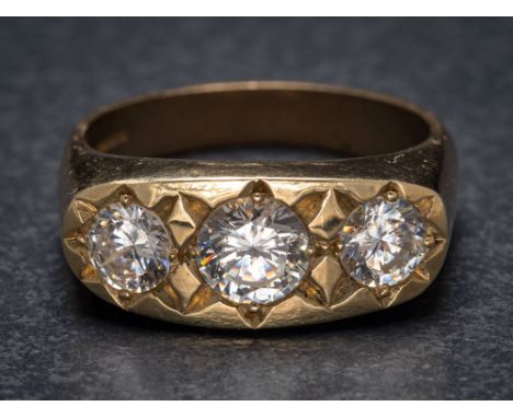 A 9ct gold and cubic zirconia three-stone ring: the shank with Sheffield assay marks, ring size R. 