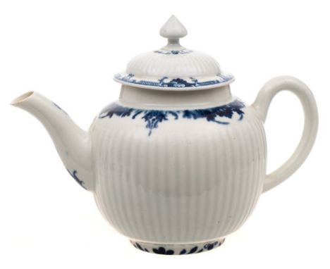 A First Period Worcester teapot and cover: of reeded globular form with pointed mushroom finial, painted with a lambrequin bo