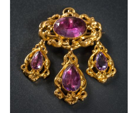 A mid 19th Century gold and foiled amethyst oval brooch: with three drops, the reverse of the brooch and each drop with glaze