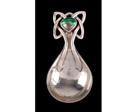 An Arts & Craft hammered silver and enamel caddy spoon, maker Ramsden & Carr, London, 1916: with pear-shaped bowl, knotted ha