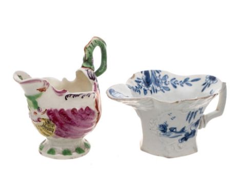 A First Period Worcester polychrome 'Dolphin Ewer' creamboat and a blue and white creamboat: the first with lamprey handle an