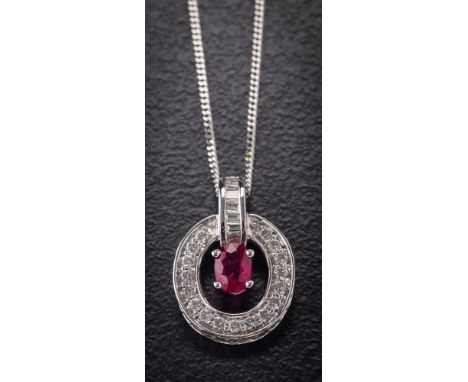 An 18ct white gold, ruby and diamond mounted pendant: with central oval ruby approximately 6.3mm x 4.2mm estimated to weigh 1